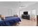 Spacious bedroom with light wood floors, a ceiling fan, and plenty of natural light at 1967 Long Boat Dr, Lakeland, FL 33810