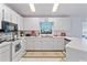 Well-equipped kitchen with white cabinets, stainless steel appliances and an island at 1967 Long Boat Dr, Lakeland, FL 33810
