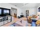 Light-filled living room with hardwood floors and view into dining area at 1967 Long Boat Dr, Lakeland, FL 33810