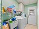 Laundry room with washer, dryer, and ample storage at 1967 Long Boat Dr, Lakeland, FL 33810