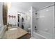 Clean bathroom includes a shower/tub combo, washer, and dryer at 10801 Sw 185Th Ter, Dunnellon, FL 34432