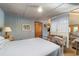 Spacious bedroom with antique-style furnishings and access to living area at 10801 Sw 185Th Ter, Dunnellon, FL 34432
