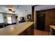 Kitchen boasts a breakfast bar, ample counter space, and dark wood cabinets at 3200 River Ranch Blvd # 204, River Ranch, FL 33867