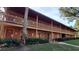Two-story building with balconies and landscaping at 3200 River Ranch Blvd # 204, River Ranch, FL 33867