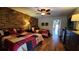 Comfortable bedroom with two twin beds, wood floors, and an adjacent balcony at 3200 River Ranch Blvd # 204, River Ranch, FL 33867