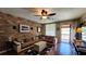 Rustic living room with brick wall and comfortable seating at 3200 River Ranch Blvd # 204, River Ranch, FL 33867