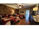 Bedroom with two twin beds, ceiling fan and brick feature wall at 3200 River Ranch Blvd # 204, River Ranch, FL 33867
