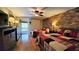 Bright bedroom with two twin beds, a ceiling fan, and brick accent wall at 3200 River Ranch Blvd # 204, River Ranch, FL 33867