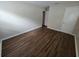 Bright bedroom with wood-look floors and ample closet space at 1911 High St, Leesburg, FL 34748