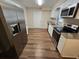 Modern kitchen with granite countertops and stainless steel appliances at 1911 High St, Leesburg, FL 34748
