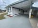 Mobile home exterior with carport and paved driveway at 34936 3Rd Ave, Leesburg, FL 34788