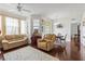 Spacious living room with hardwood floors, and large windows at 612 Terrace Ridge Cir # 612, Davenport, FL 33896