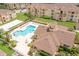 Aerial view of community pool, clubhouse, and surrounding buildings at 612 Terrace Ridge Cir # 612, Davenport, FL 33896