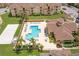 Community pool with surrounding lounge chairs at 612 Terrace Ridge Cir # 612, Davenport, FL 33896