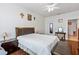 Primary bedroom with ensuite bath and wood floors at 612 Terrace Ridge Cir # 612, Davenport, FL 33896