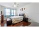 Bedroom with wood floors, ceiling fan and ensuite access at 612 Terrace Ridge Cir # 612, Davenport, FL 33896