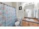 Clean bathroom with shower/tub combo and wood vanity at 612 Terrace Ridge Cir # 612, Davenport, FL 33896