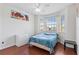 Bright bedroom with bay window, ceiling fan, and wood floors at 612 Terrace Ridge Cir # 612, Davenport, FL 33896