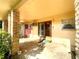 Covered porch with brick columns and double entry doors at 250 W New York Ave, Orange City, FL 32763
