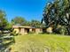 Ranch style home with mature landscaping and large yard at 250 W New York Ave, Orange City, FL 32763