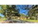 Charming single story home nestled amongst mature trees, offering curb appeal at 250 W New York Ave, Orange City, FL 32763