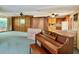 Living room with kitchen view, piano, and wood features at 250 W New York Ave, Orange City, FL 32763
