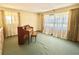 Spacious living room with large windows and neutral carpeting at 250 W New York Ave, Orange City, FL 32763