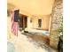 Covered porch with brick columns, double doors and side entry at 250 W New York Ave, Orange City, FL 32763