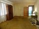 Living room featuring hardwood floors and built-in shelving at 217 Catalonia Ave, De Leon Springs, FL 32130