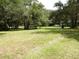 Vacant lot with grassy area and mature trees at 217 Catalonia Ave, De Leon Springs, FL 32130