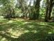 Spacious lot with mature trees and grassy area at 217 Catalonia Ave, De Leon Springs, FL 32130
