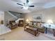 Living room with a view of staircase, comfortable seating, and a fireplace at 4150 S Atlantic Ave # 107C, New Smyrna Beach, FL 32169