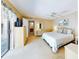 Bright bedroom with a king-size bed and access to a private balcony at 4150 S Atlantic Ave # 107C, New Smyrna Beach, FL 32169