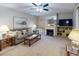 Living room features a fireplace, comfy seating, and a large TV at 4150 S Atlantic Ave # 107C, New Smyrna Beach, FL 32169