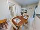 Dining area with table and chairs, looking toward living room at 4150 S Atlantic Ave # 107C, New Smyrna Beach, FL 32169