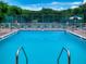 Community pool with plenty of lounge chairs at 4150 S Atlantic Ave # 107C, New Smyrna Beach, FL 32169