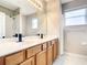 Bathroom boasts double vanity, large mirror, and shower at 319 Ravenshill Way, Deland, FL 32724