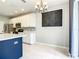 Modern kitchen with white cabinets, a large island, and stainless steel appliances at 319 Ravenshill Way, Deland, FL 32724