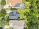 Aerial view showcasing home's location, landscaping, and pool at 319 Ravenshill Way, Deland, FL 32724