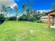 Large backyard with grassy area and privacy fence at 319 Ravenshill Way, Deland, FL 32724