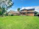 Spacious backyard with two-story home and fence at 319 Ravenshill Way, Deland, FL 32724