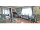 Living room with seating, TV, and glass-top coffee table at 9 Villa Villar Ct, Deland, FL 32724