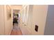 Hallway with wood floors and access to bedrooms and closets at 9 Villa Villar Ct, Deland, FL 32724