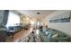 Open living space with hardwood floors, neutral decor, and views of dining area at 9 Villa Villar Ct, Deland, FL 32724