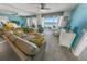 Bright living room with ocean view and comfy seating at 4575 S Atlantic Ave # 6307, Ponce Inlet, FL 32127