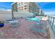 Relaxing pool area with patio furniture at 4575 S Atlantic Ave # 6307, Ponce Inlet, FL 32127