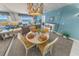 Bright dining area with ocean view and stylish chandelier at 4575 S Atlantic Ave # 6307, Ponce Inlet, FL 32127