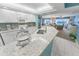 Modern kitchen with white cabinets and granite counters at 4575 S Atlantic Ave # 6307, Ponce Inlet, FL 32127