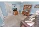 Bright office with built-in shelving and a comfortable sofa at 4575 S Atlantic Ave # 6307, Ponce Inlet, FL 32127