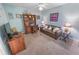 Home office with a desk, sofa, and built-in shelving at 4575 S Atlantic Ave # 6307, Ponce Inlet, FL 32127